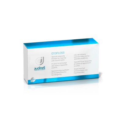 A blue and white Otofloss box by audinell containing special cleaning threads for hearing aid sound tubes, with multilingual product information on the front.